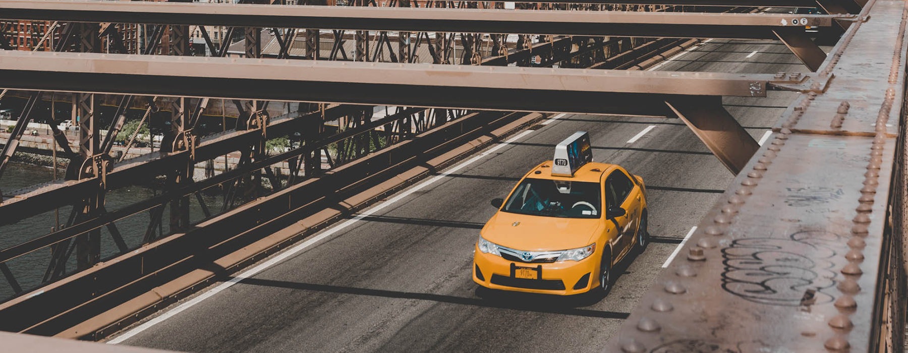 taxi driving on bridge